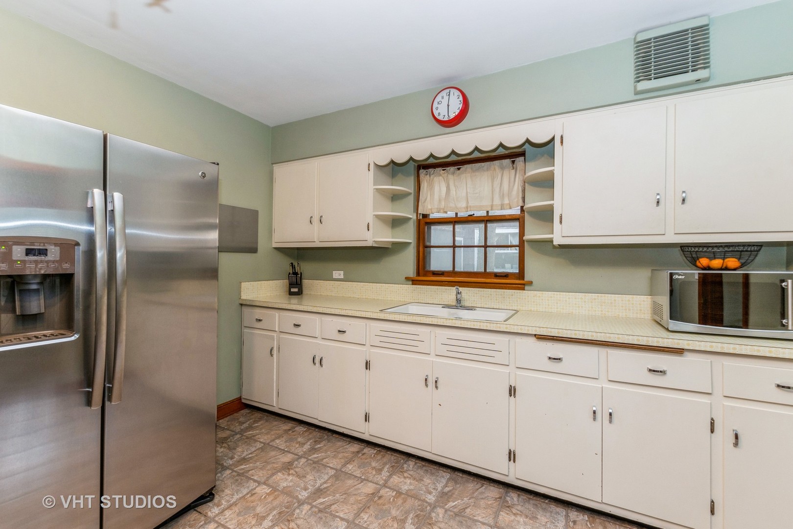 1825 Evergreen Road Homewood, IL 60430 - Photo 4 of 12 a kitchen with granite countertop a refrigerator sink and cabinets