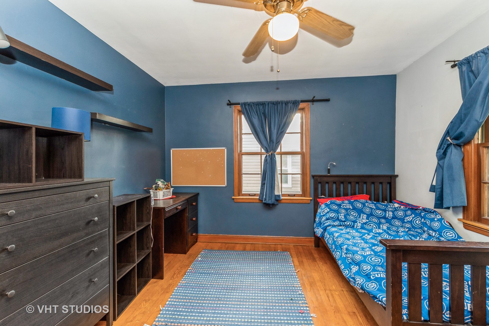 1825 Evergreen Road Homewood, IL 60430 - Photo 6 of 12 a bedroom with a bed and wooden floor