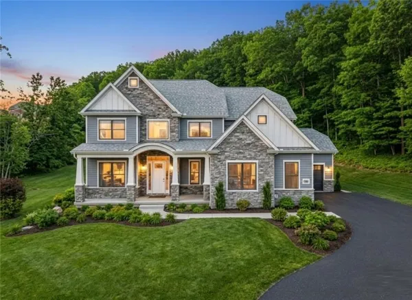 front view of a house with a yard