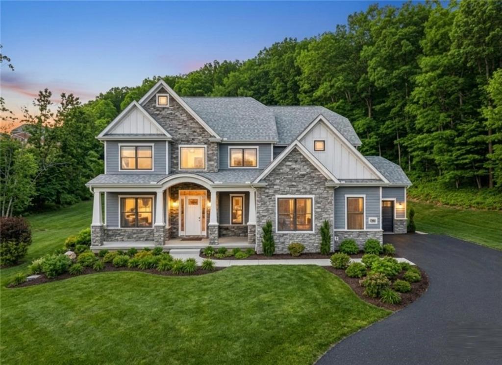 front view of a house with a yard
