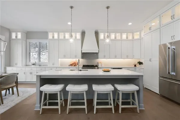 a dining table with chairs and window