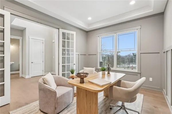 a dining room with furniture and window