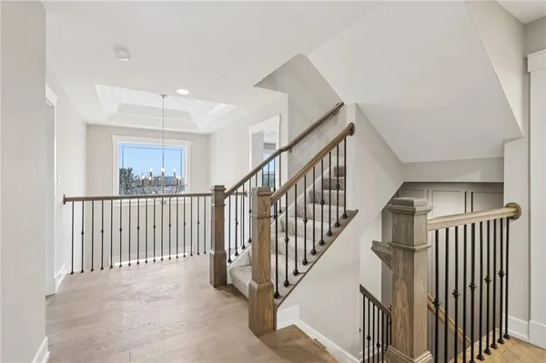 a view of staircase with lots of wooden floor