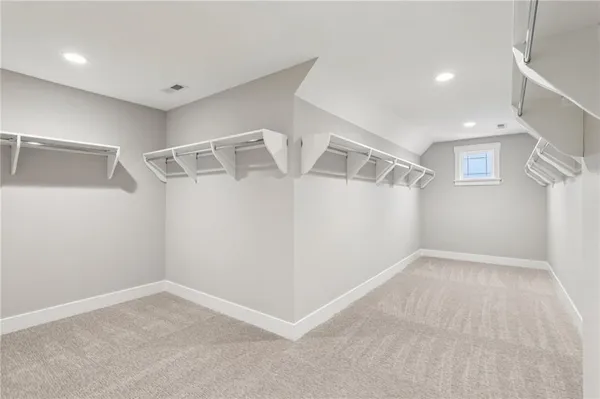 a view of an empty room with windows