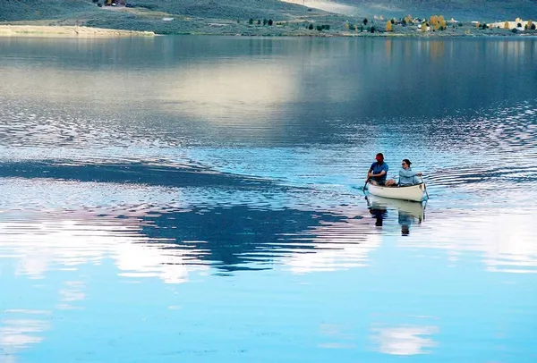 a swimming pool with wooden floor