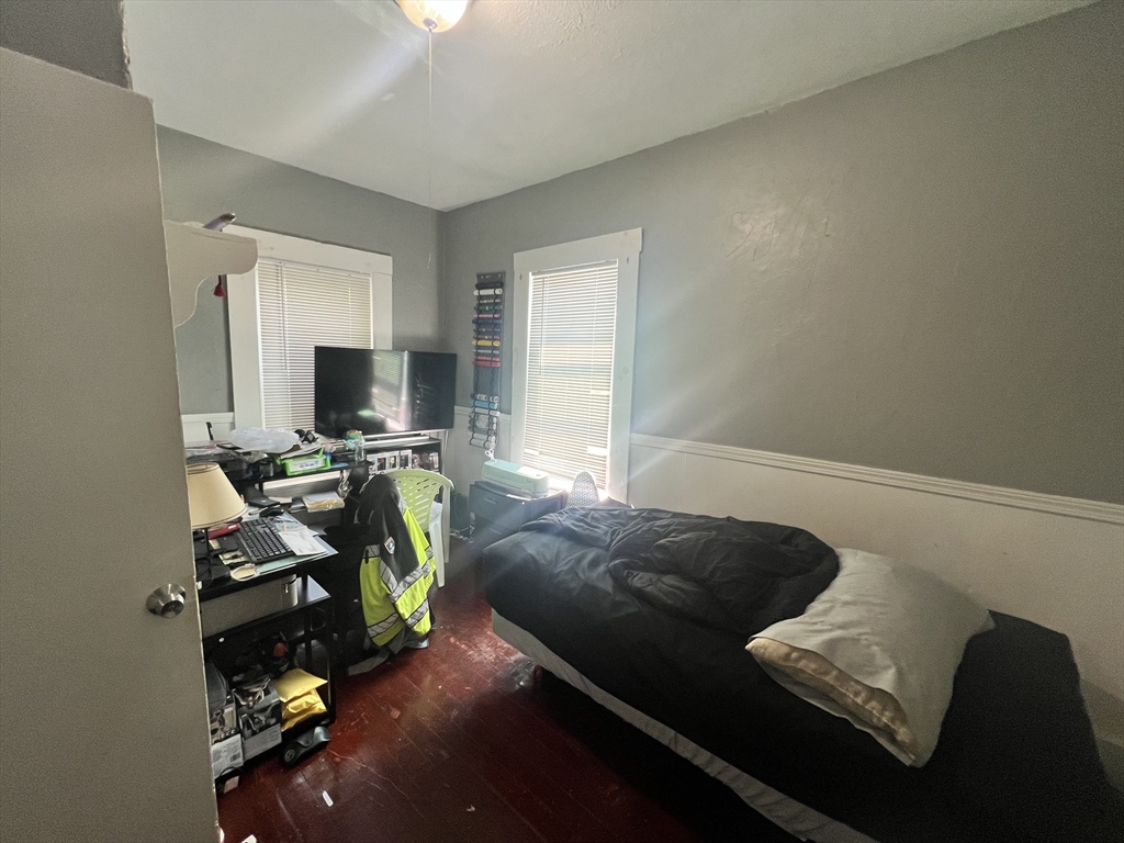 75 Intervale Street, Unit 1 Brockton, MA 02302 - Photo 4 of 11 a living room with furniture and a flat screen tv
