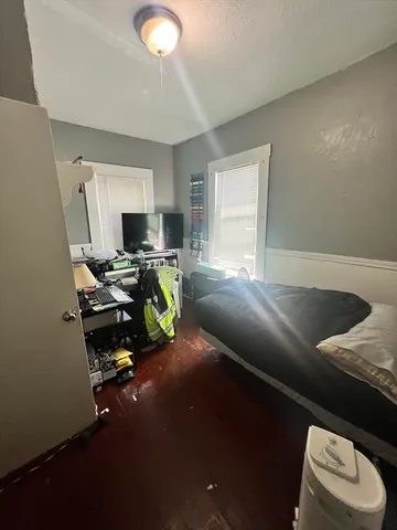 a bed room with a bed furniture and a window