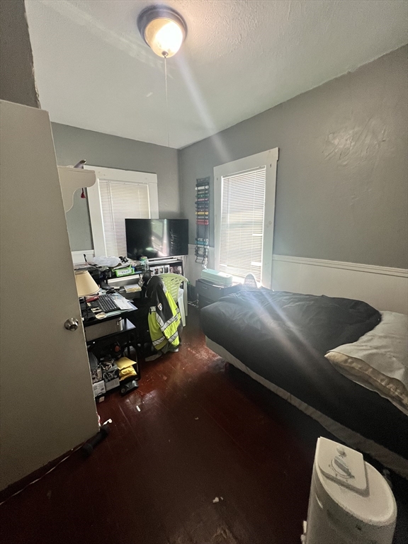 75 Intervale Street, Unit 1 Brockton, MA 02302 - Photo 5 of 11 a bed room with a bed furniture and a window