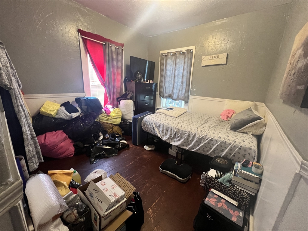 75 Intervale Street, Unit 1 Brockton, MA 02302 - Photo 9 of 11 a bedroom with a bed next to a window