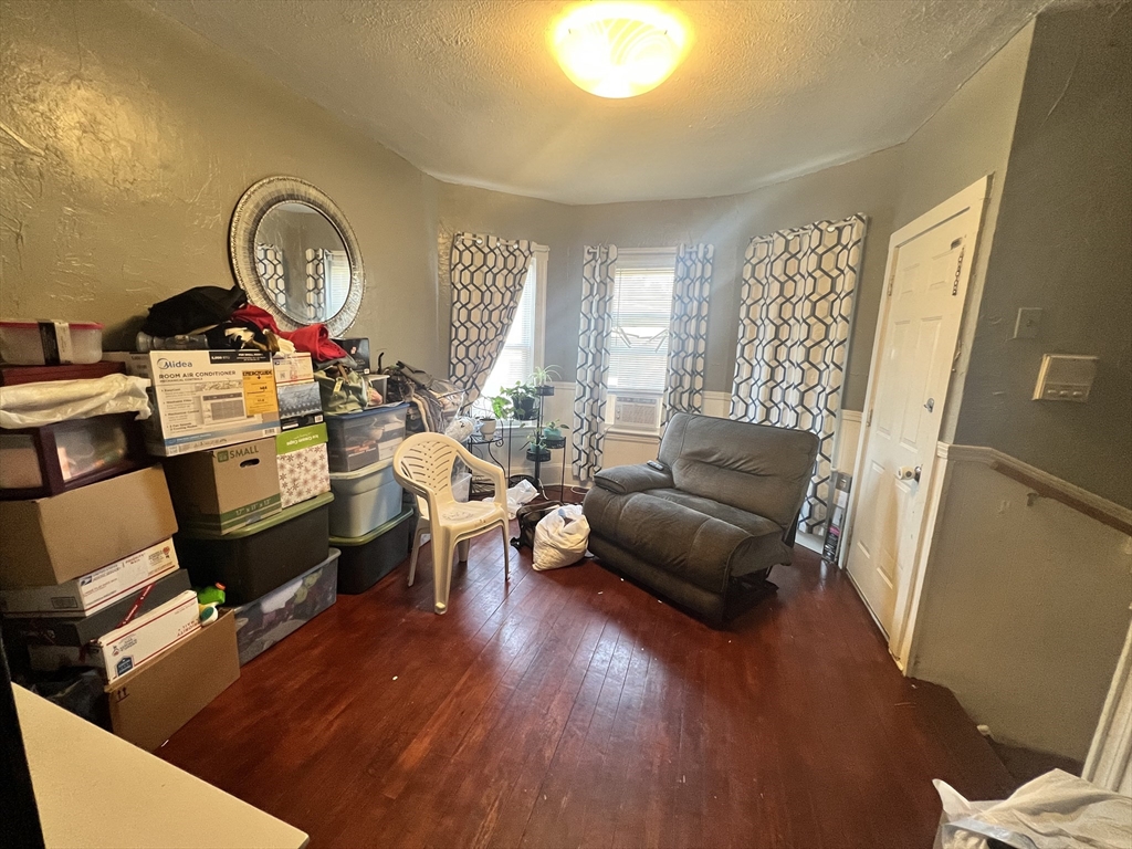 75 Intervale Street, Unit 1 Brockton, MA 02302 - Photo 10 of 11 a living room with furniture and a wooden floor
