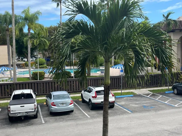 a swimming pool with outdoor seating and yard