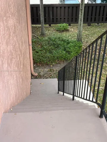 a view of a backyard from a porch