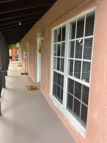 a view of empty room with windows