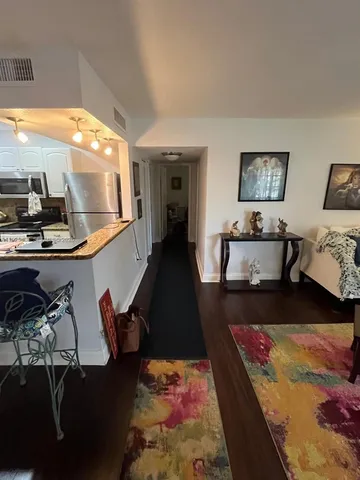 a bedroom with a bed and a desk