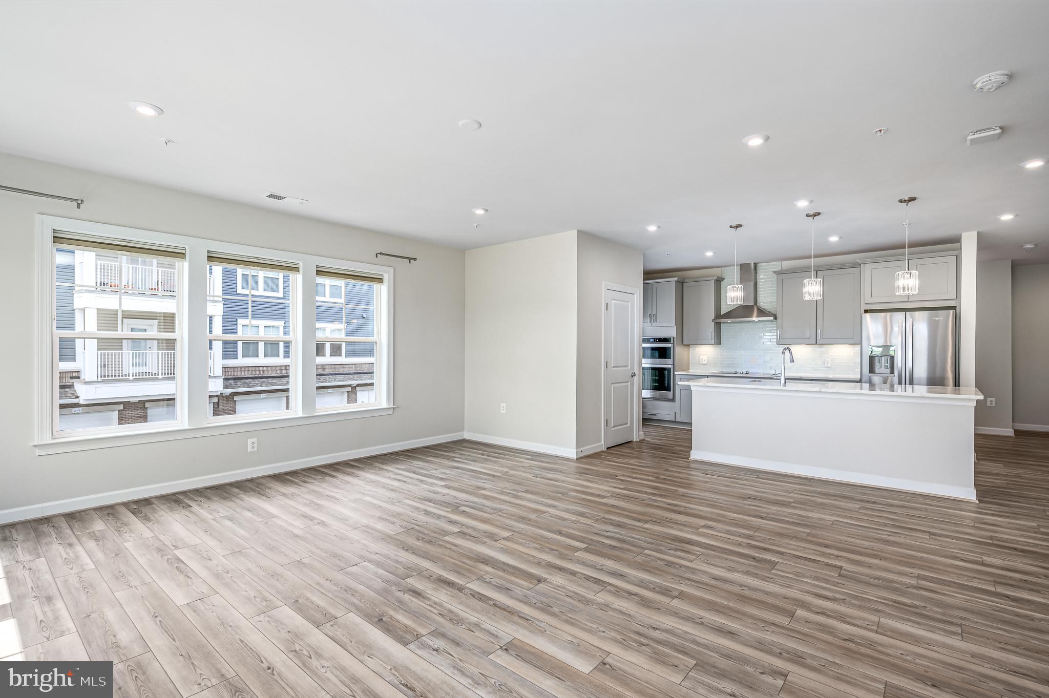 21894 Hawksbill High Circle, Unit 201 Sterling, VA 20164 - Photo 12 of 54 Living/Dining Area