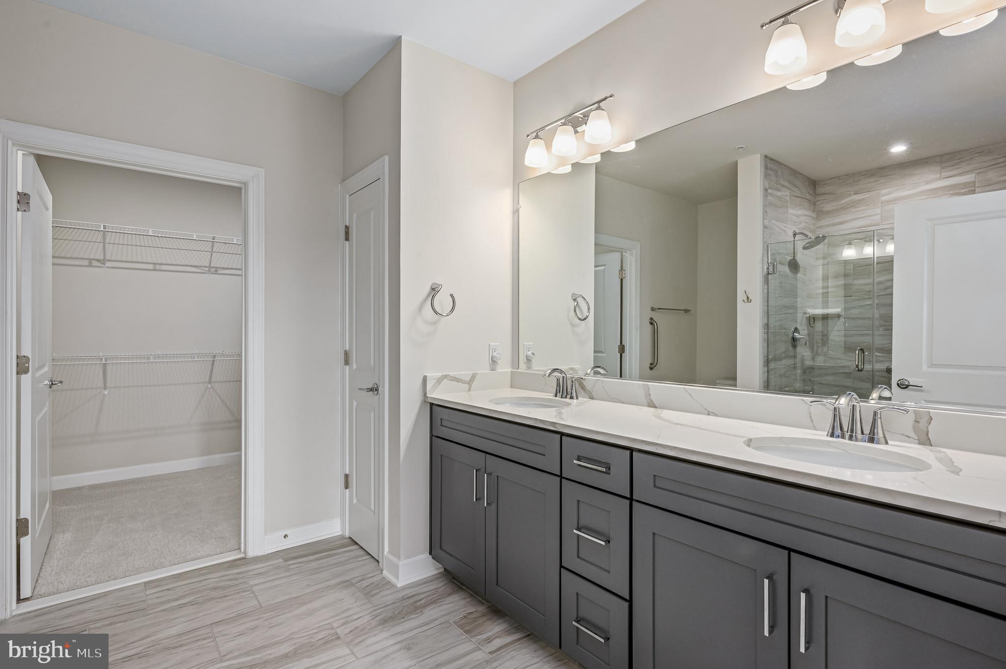 21894 Hawksbill High Circle, Unit 201 Sterling, VA 20164 - Photo 17 of 54 Owner's Bath with dual vanities