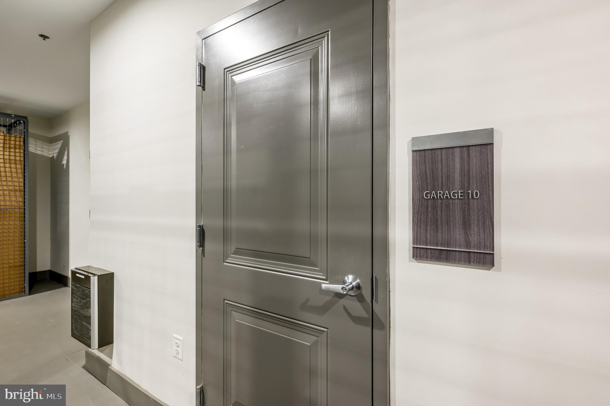 21894 Hawksbill High Circle, Unit 201 Sterling, VA 20164 - Photo 29 of 54 Door to Garage