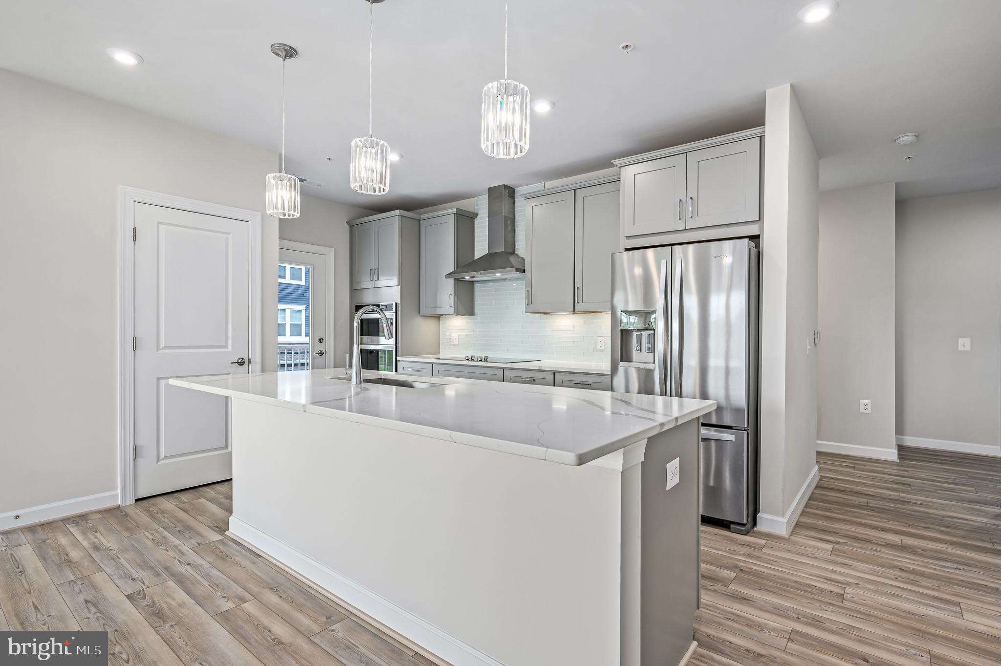 21894 Hawksbill High Circle, Unit 201 Sterling, VA 20164 - Photo 4 of 54 Beautiful quartz countertops with pendant lighting