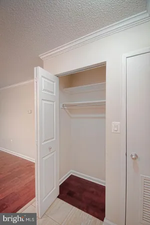 a view of hallway with walk in closet
