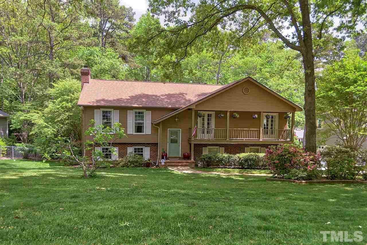 This beautifully landscaped home is partial brick veneer and aluminum siding. The balcony style porch and front stoop add character to this split foyer home.