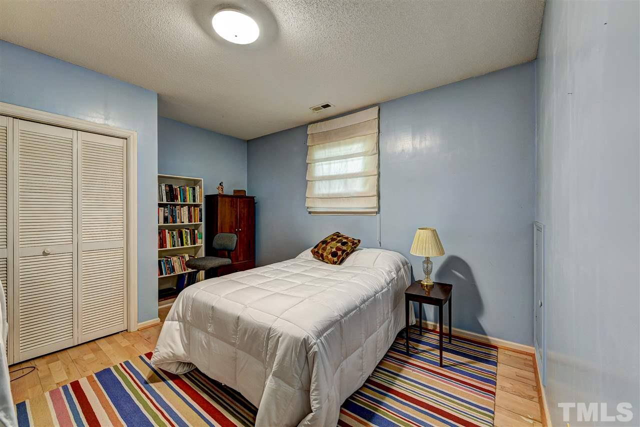 6712 Perkins Drive Raleigh, NC 27612 - Photo 20 of 30 Bed Room four has bamboo flooring, 1 window and closet. 12 x 10'10