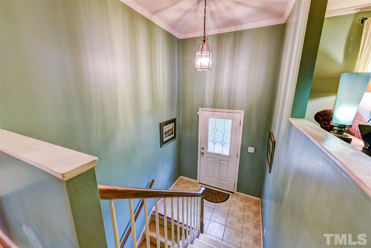 6712 Perkins Drive Raleigh, NC 27612 - Photo 4 of 30 This split foyer leads you up to the main floor and down to the lower basement area, where you find the 4th bedroom, 3rd full bath, family room, 1 car garage, laundry area and small storage room. Tile flooring.