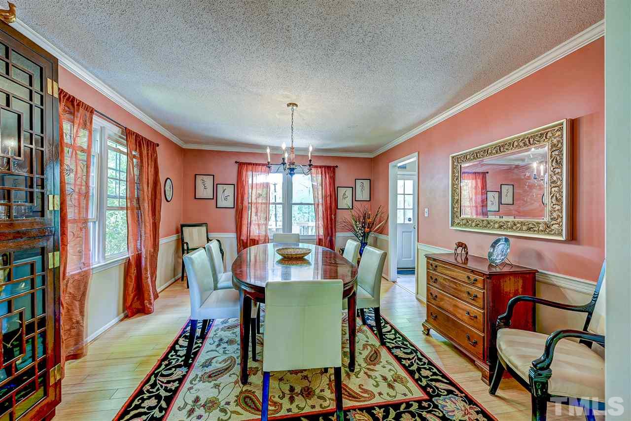 6712 Perkins Drive Raleigh, NC 27612 - Photo 8 of 30 This dining room is light and bright with it's large windows. Bamboo flooring. 13'11 x 12