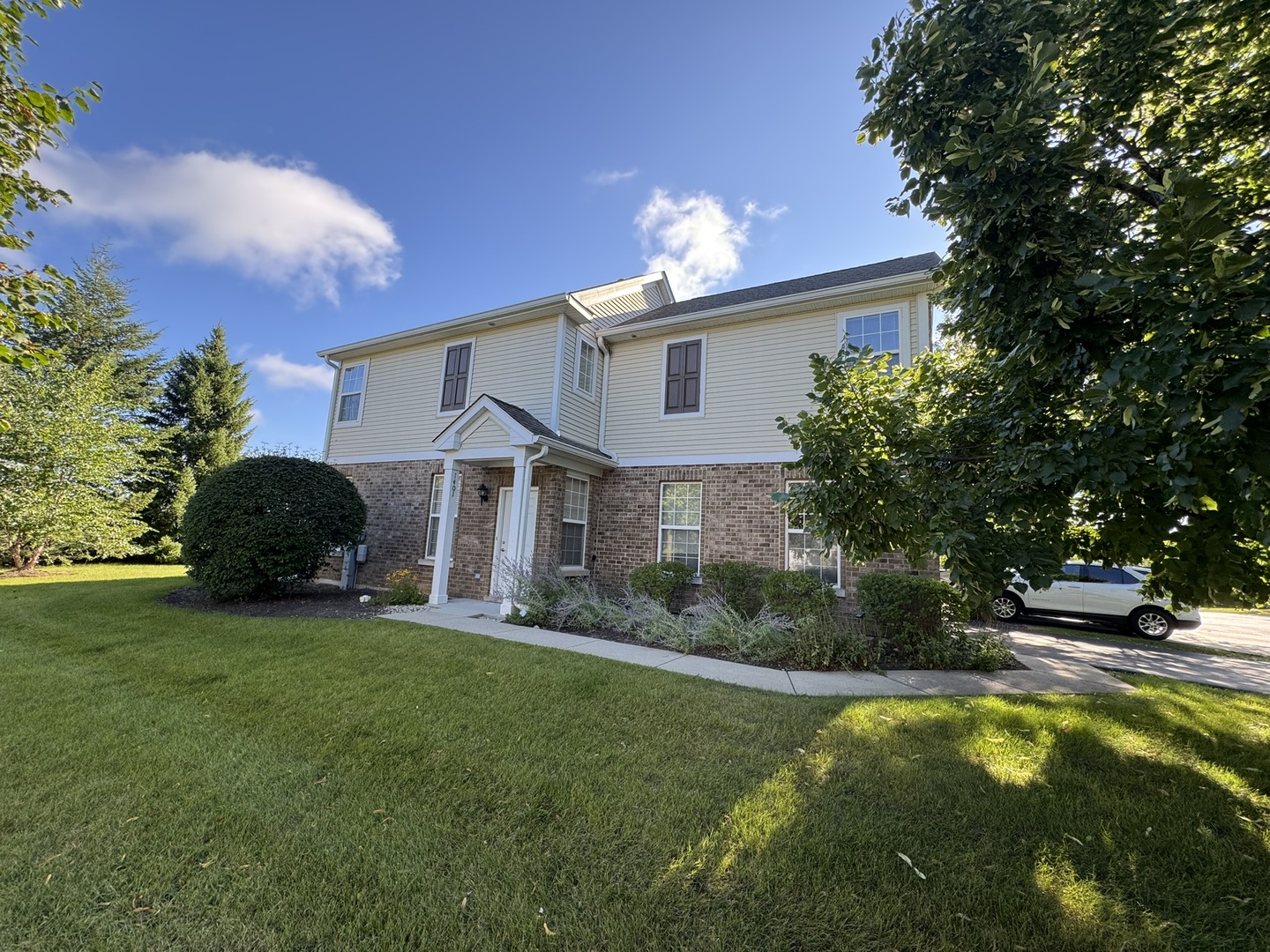 1401 Millbrook Drive Algonquin, IL 60102 - Photo 1 of 14 a view of a house with a yard and sitting area