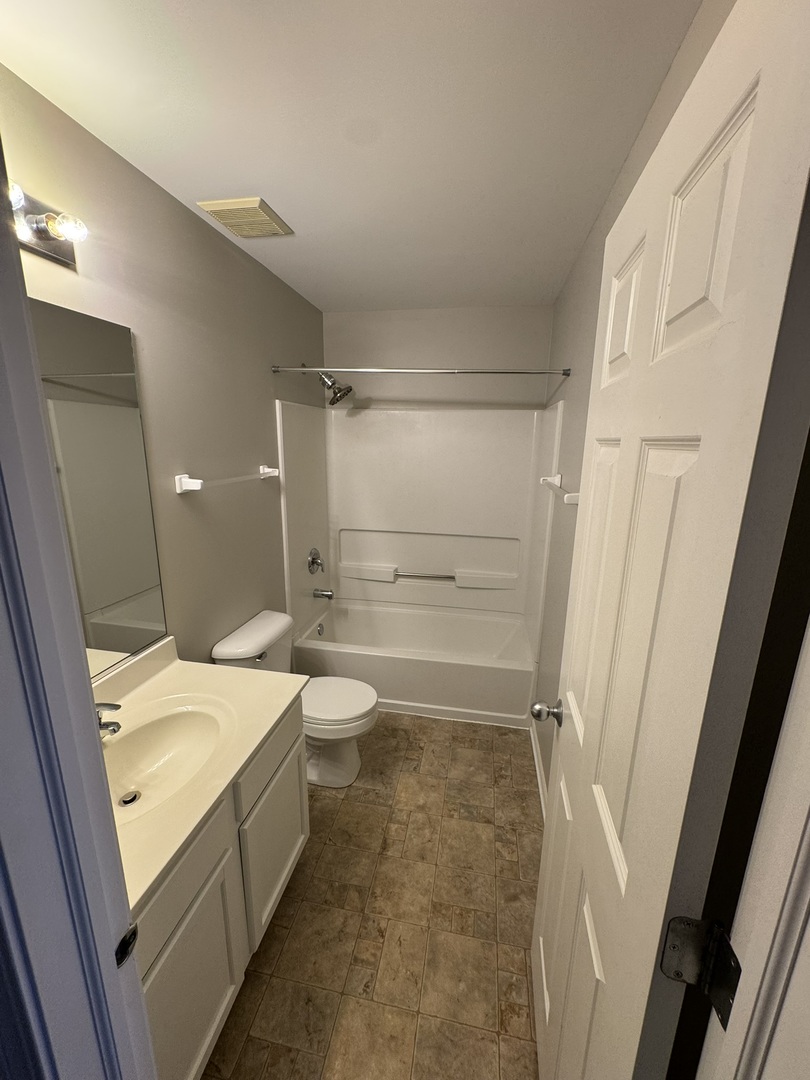 1401 Millbrook Drive Algonquin, IL 60102 - Photo 11 of 14 a bathroom with a sink and a shower