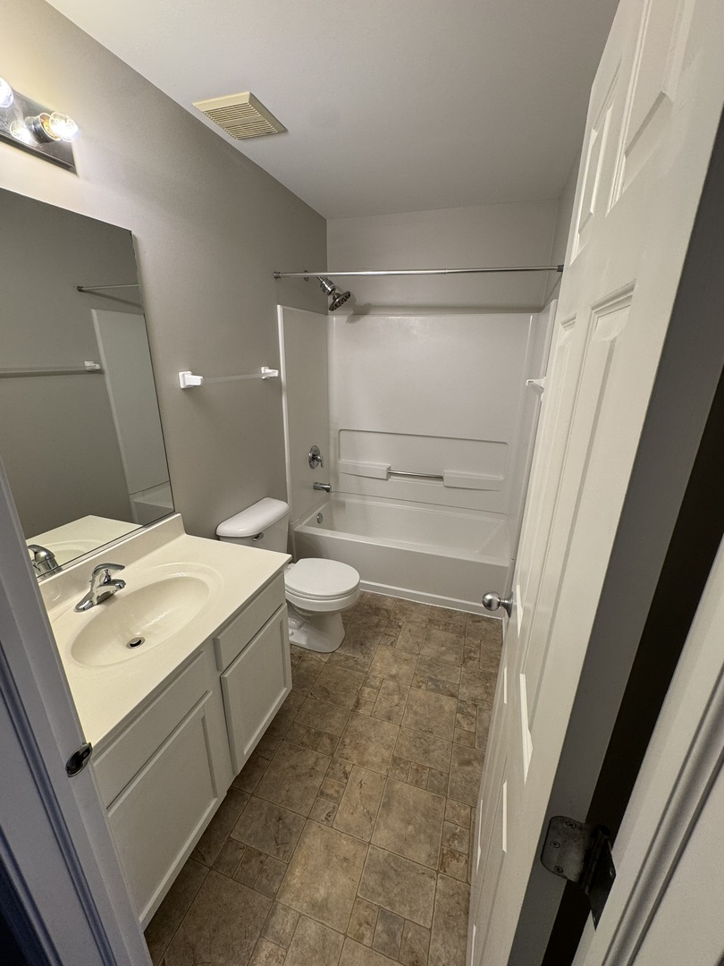 1401 Millbrook Drive Algonquin, IL 60102 - Photo 14 of 14 a bathroom with a sink a toilet and shower