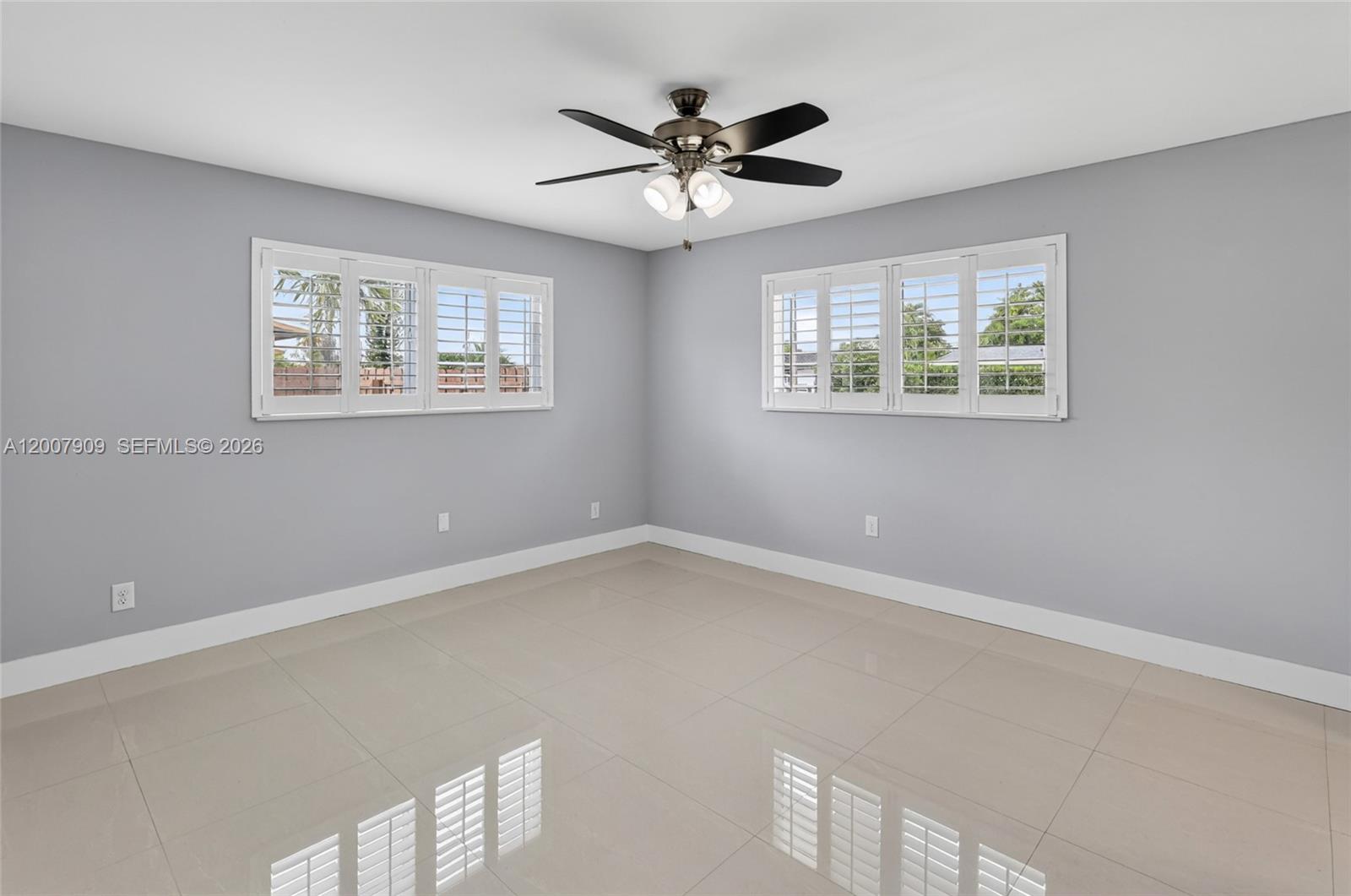 4865 Southwest 94th Avenue Miami, FL 33165 - Photo 11 of 32 a view of an empty room with a window
