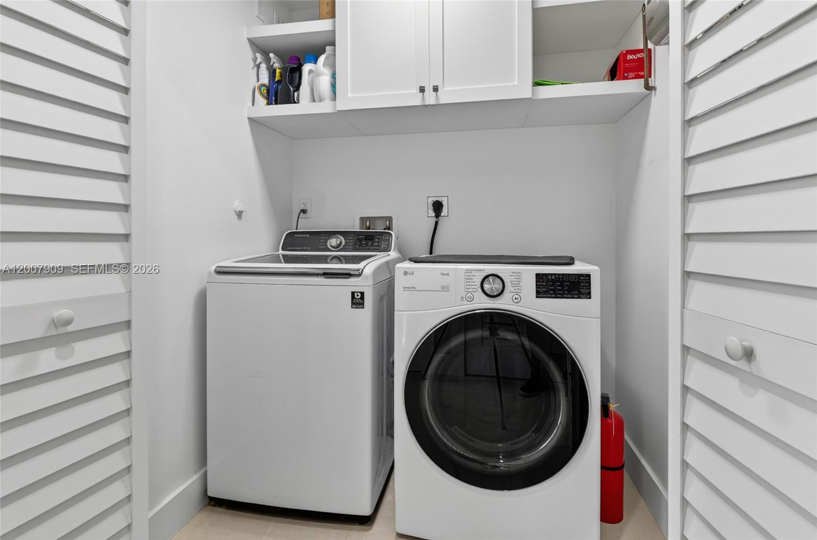 4865 Southwest 94th Avenue Miami, FL 33165 - Photo 16 of 32 a utility room with dryer and washer