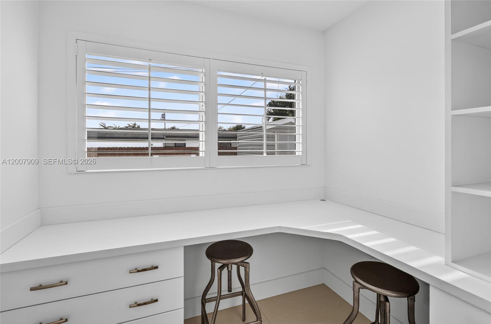 4865 Southwest 94th Avenue Miami, FL 33165 - Photo 22 of 32 a room with a window and a table