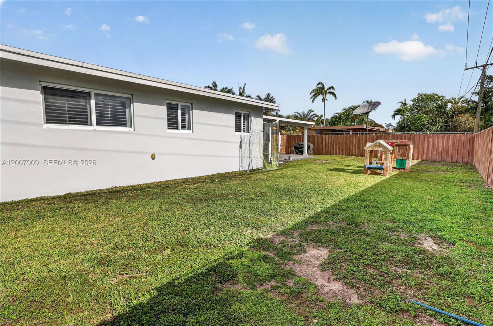 4865 Southwest 94th Avenue Miami, FL 33165 - Photo 26 of 32 a front view of a house with garden