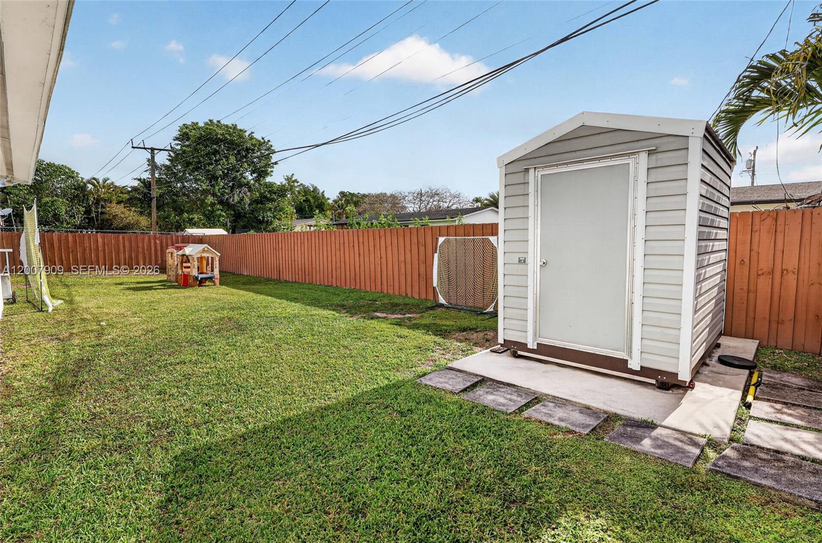 4865 Southwest 94th Avenue Miami, FL 33165 - Photo 28 of 32 a view of backyard with a garden and entertaining space