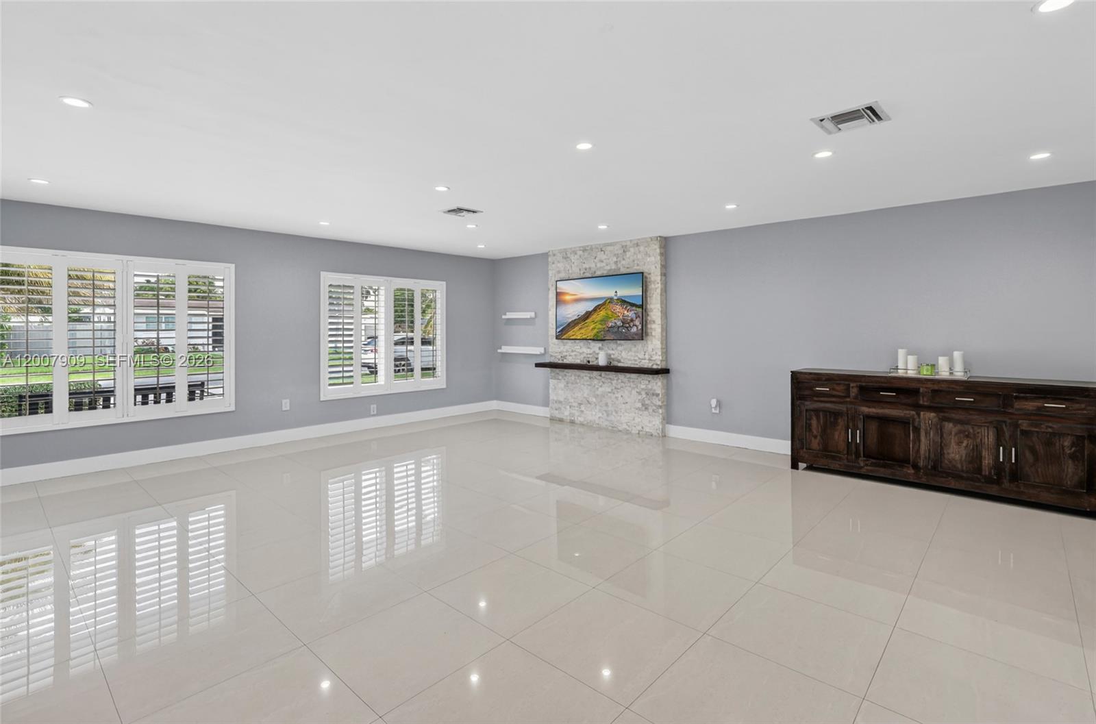4865 Southwest 94th Avenue Miami, FL 33165 - Photo 5 of 32 a view of living room filled with furniture and window