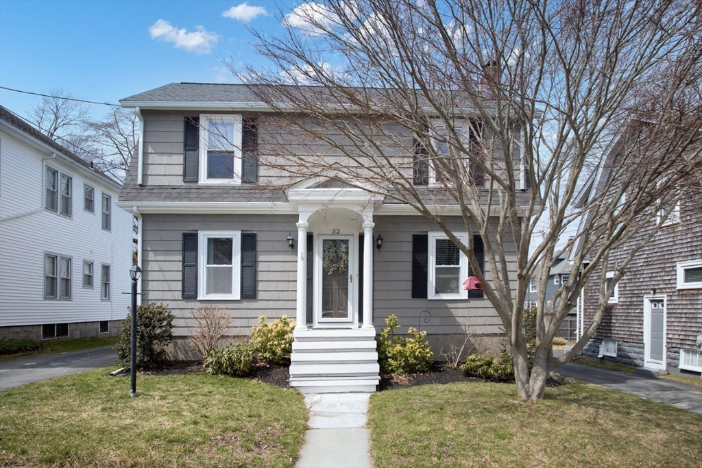 32 Oakland Street Fall River, MA 02720 - Photo 1 of 35 a front view of a house with garden