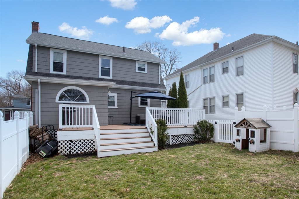 32 Oakland Street Fall River, MA 02720 - Photo 12 of 35 a view of a house with a big yard and large trees