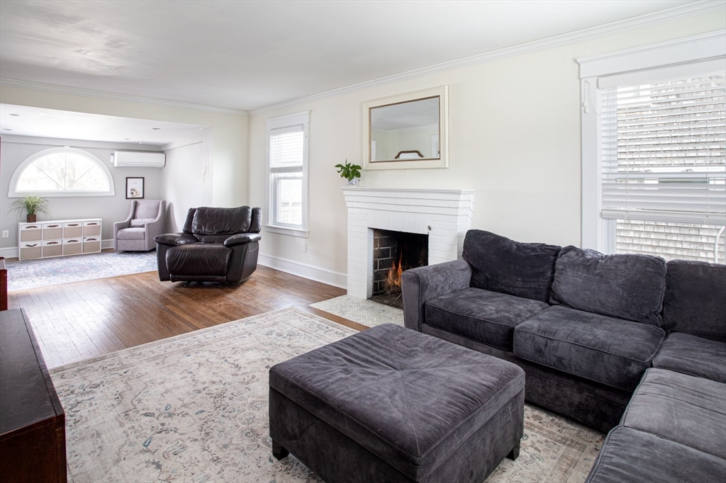 32 Oakland Street Fall River, MA 02720 - Photo 20 of 35 a living room with furniture and a fireplace