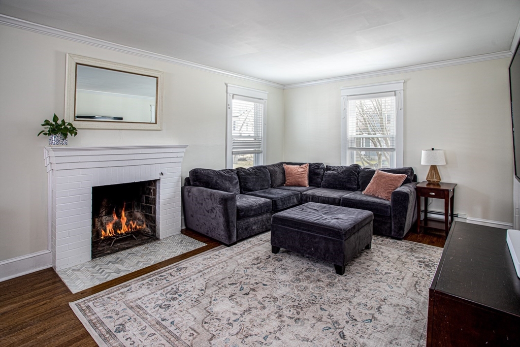 32 Oakland Street Fall River, MA 02720 - Photo 21 of 35 a living room with furniture and a fireplace