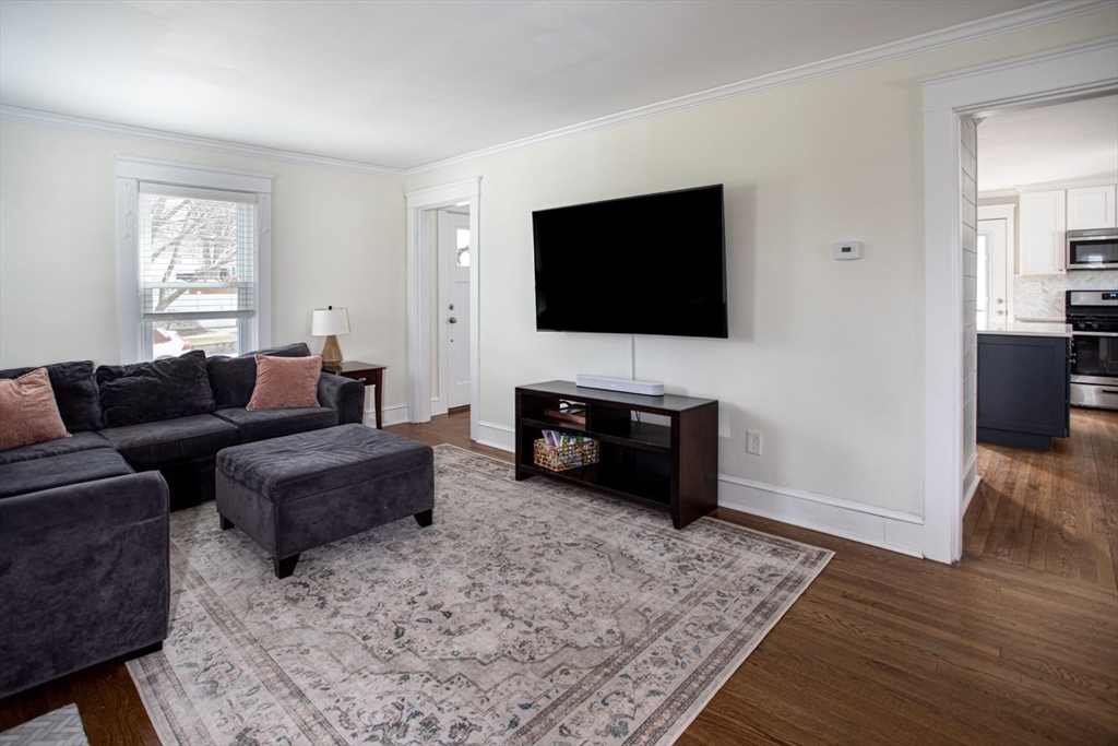 32 Oakland Street Fall River, MA 02720 - Photo 22 of 35 a living room with furniture and a flat screen tv