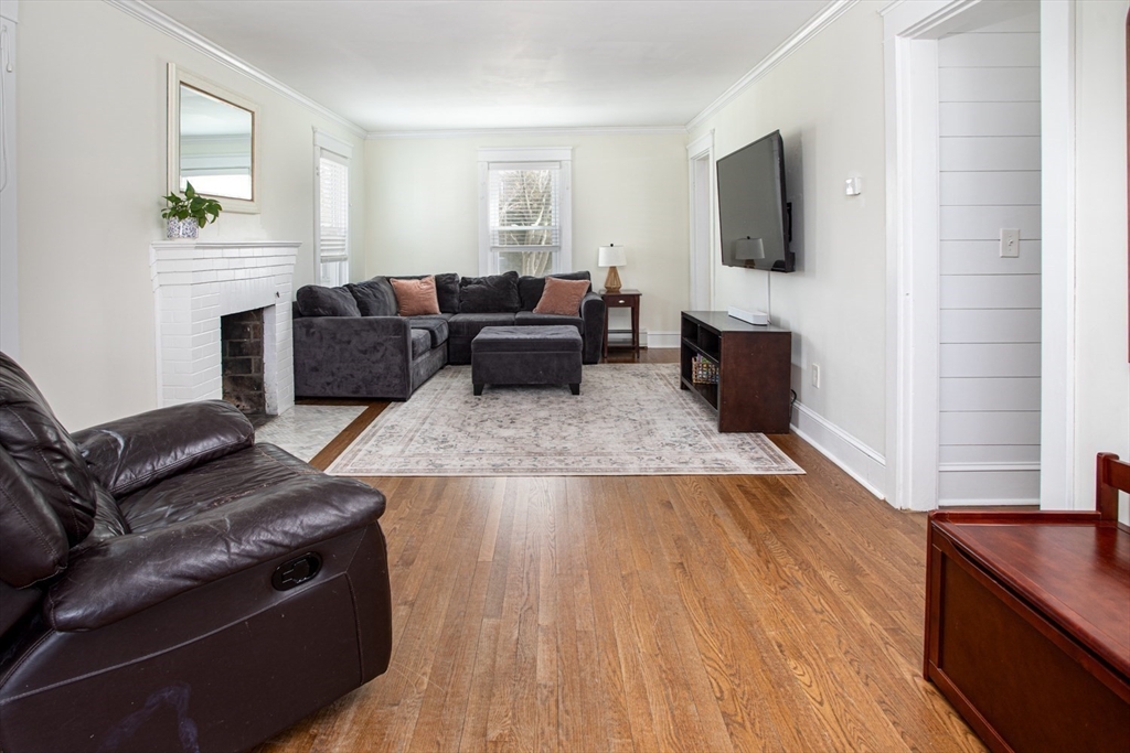 32 Oakland Street Fall River, MA 02720 - Photo 25 of 35 a living room with furniture and a flat screen tv