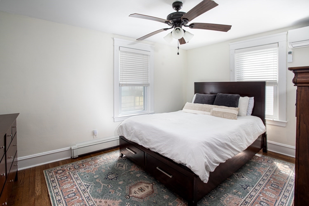 32 Oakland Street Fall River, MA 02720 - Photo 27 of 35 a large bed sitting in a bedroom next to a window