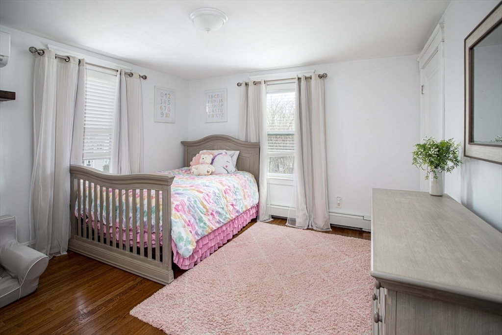 32 Oakland Street Fall River, MA 02720 - Photo 30 of 35 a bedroom with a bed and window