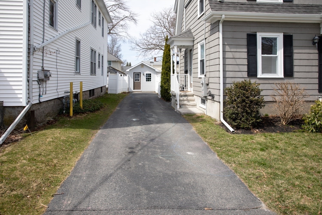 32 Oakland Street Fall River, MA 02720 - Photo 4 of 35 a view of a back yard of the house