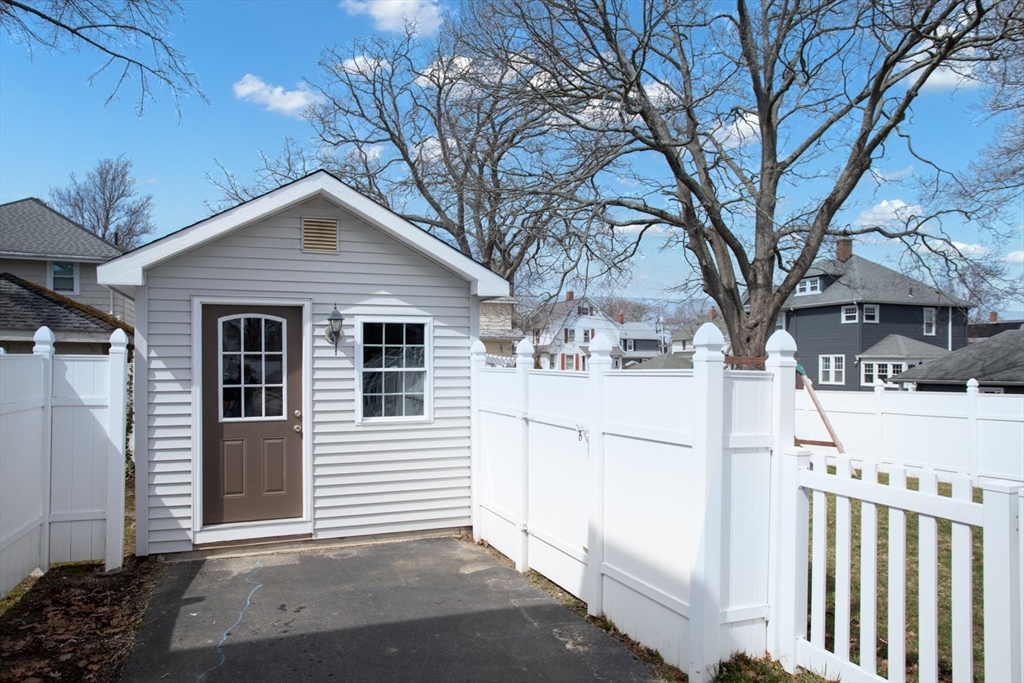 32 Oakland Street Fall River, MA 02720 - Photo 5 of 35 a white house that has tree in front of it