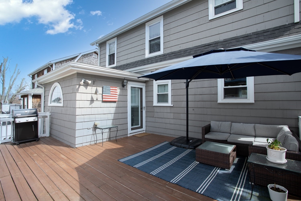 32 Oakland Street Fall River, MA 02720 - Photo 6 of 35 a front view of a house with barbeque area and seating space