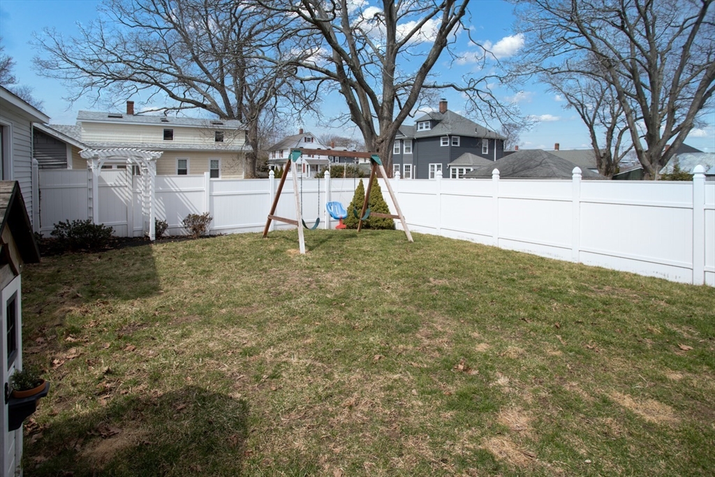 32 Oakland Street Fall River, MA 02720 - Photo 9 of 35 a view of a house with a yard
