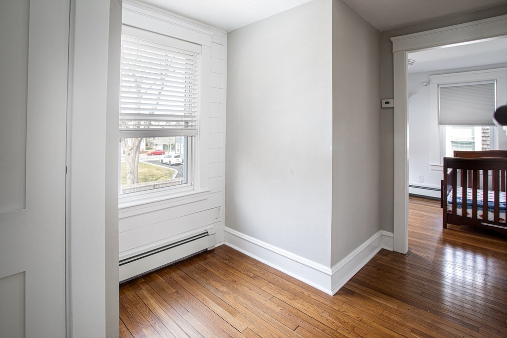 32 Oakland Street Fall River, MA 02720 - Photo 10 of 35 a view of an empty room with wooden floor and a window