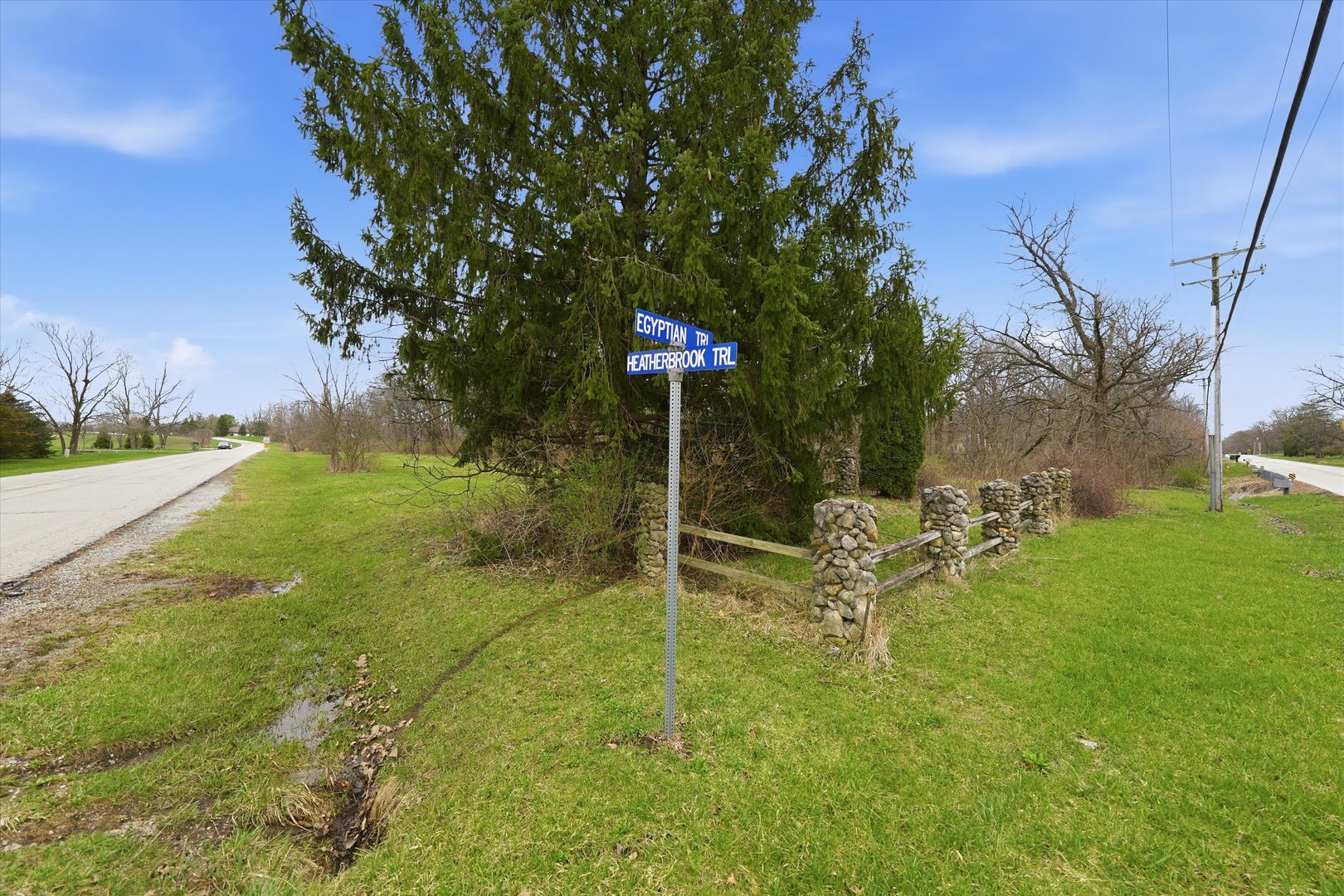 5525 West Heatherbrook Trail Monee, IL 60449 - Photo 2 of 20 a sign board with tree in the background